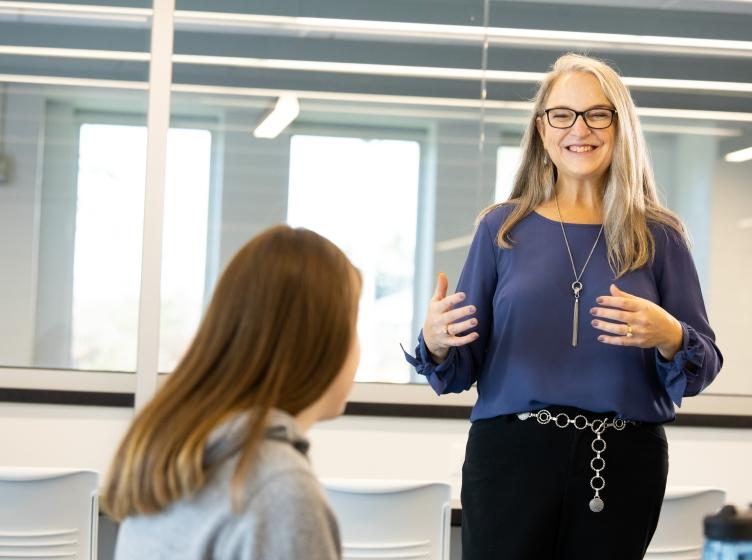 Dr. Kristin Saggedy speaks to a student